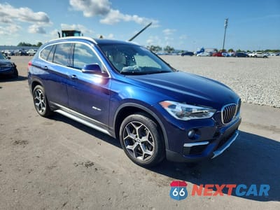 Czwarte zdjęcie samochodu z boku: 2017 BMW X1 SDRIVE28I VIN:WBXHU7C34H5H37583 - miniatura