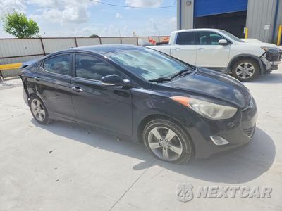 Czwarte zdjęcie samochodu z boku: 2012 HYUNDAI ELANTRA GLS VIN:KMHDH4AE2CU356485 - miniatura