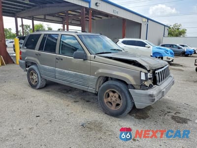 Czwarte zdjęcie samochodu z boku: 1997 JEEP GRAND CHEROKEE LAREDO VIN:1J4FX58S9VC726870 - miniatura