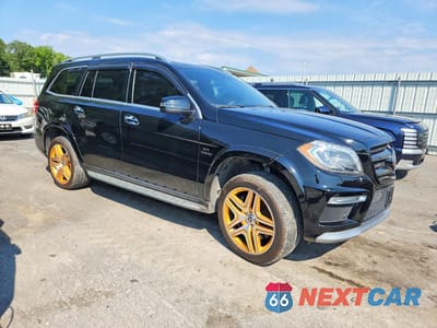 Czwarte zdjęcie samochodu z boku: 2015 MERCEDES-BENZ GL 63 AMG VIN:4JGDF7EE1FA489228 - miniatura