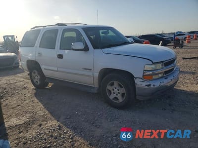 Czwarte zdjęcie samochodu z boku: 2002 CHEVROLET TAHOE C1500 VIN:1GNEC13V82R221894 - miniatura
