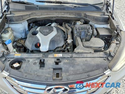 Zdjęcie 12 z 13 samochodu: 2013 HYUNDAI SANTA FE SPORT 2.0T VIN:5XYZWDLA4DG033570 - miniatura