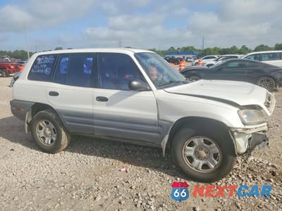 Czwarte zdjęcie samochodu z boku: 1999 TOYOTA RAV4 BASE VIN:JT3GP10V1X0035107 - miniatura