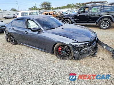 Czwarte zdjęcie samochodu z boku: 2022 BMW M340I VIN:3MW5U7J09N8C60781 - miniatura
