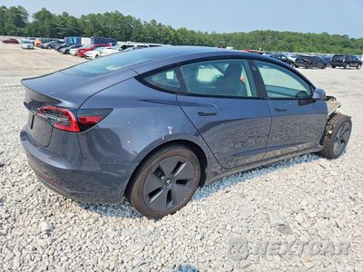 Trzecie zdjęcie samochodu z tyłu: 2023 TESLA MODEL 3 VIN:5YJ3E1EA1PF655706 - miniatura