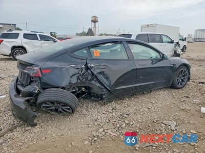 Trzecie zdjęcie samochodu z tyłu: 2023 TESLA MODEL 3 VIN:5YJ3E1EA2PF506821 - miniatura