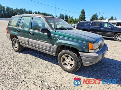 Czwarte zdjęcie samochodu z boku: 1997 JEEP GRAND CHEROKEE LAREDO VIN:1J4GZ58S6VC727280 - miniatura