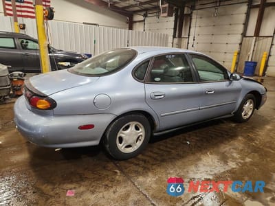 Trzecie zdjęcie samochodu z tyłu: 1997 FORD TAURUS GL VIN:1FALP52U4VA237474 - miniatura