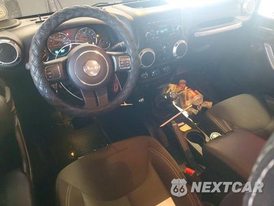 Zdjęcie 8 z 13 samochodu: 2015 JEEP WRANGLER UNLIMITED SAHARA VIN:1C4BJWEG6FL690620 - miniatura