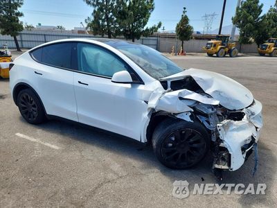 Czwarte zdjęcie samochodu z boku: 2023 TESLA MODEL Y VIN:7SAYGAEE6PF697231 - miniatura