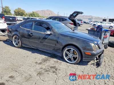 Czwarte zdjęcie samochodu z boku: 2002 MERCEDES-BENZ CLK 430 VIN:WDBLJ70G92T111615 - miniatura