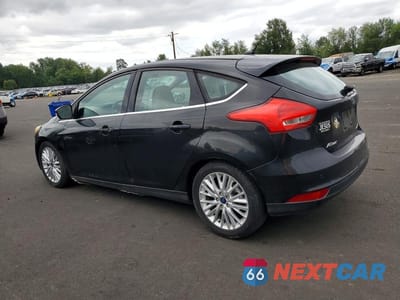 Drugie zdjęcie samochodu z przodu: 2015 FORD FOCUS TITANIUM VIN:1FADP3N22FL222111 - miniatura