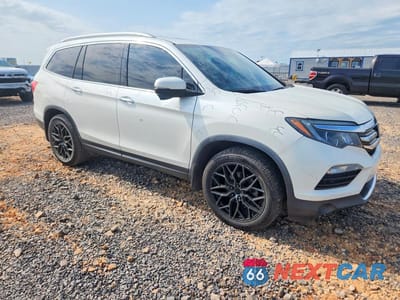 Czwarte zdjęcie samochodu z boku: 2017 HONDA PILOT TOURING VIN:5FNYF5H93HB041432 - miniatura