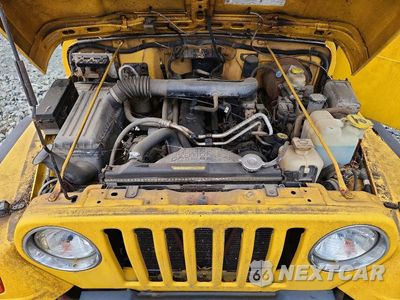 Zdjęcie 11 z 12 samochodu: 2000 JEEP WRANGLER / TJ SPORT VIN:1J4FA49S7YP727443 - miniatura