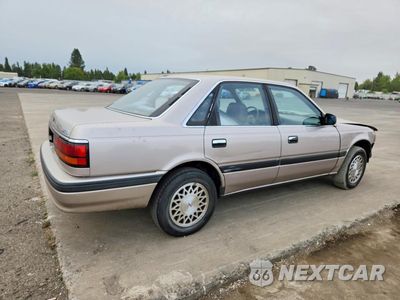 Trzecie zdjęcie samochodu z tyłu: 1990 MAZDA 626 DX VIN:JM1GD2223L1816521 - miniatura
