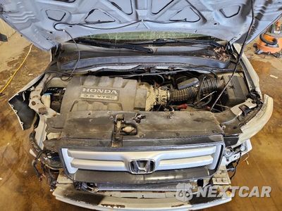 Zdjęcie 12 z 13 samochodu: 2006 HONDA PILOT EX VIN:2HKYF18486H515578 - miniatura
