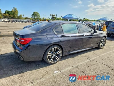 Trzecie zdjęcie samochodu z tyłu: 2018 BMW 740 I VIN:WBA7E2C51JG741976 - miniatura