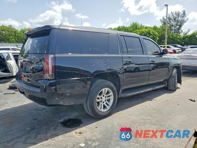 Trzecie zdjęcie samochodu z tyłu: 2019 CHEVROLET SUBURBAN C1500 PREMIER VIN:1GNSCJKC1KR306675 - miniatura