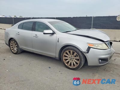 Czwarte zdjęcie samochodu z boku: 2012 LINCOLN MKS VIN:1LNHL9DR7CG806707 - miniatura