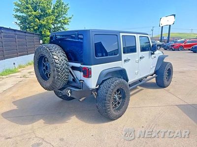 Czwarte zdjęcie samochodu z boku: 2015 JEEP WRANGLER UNLIMITED RUBICON VIN:1C4BJWFG3FL530855 - miniatura