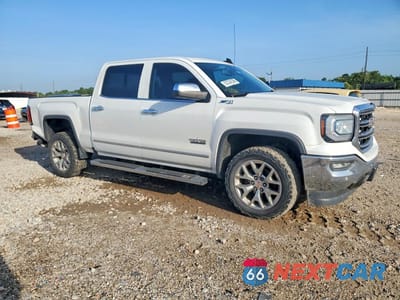 Czwarte zdjęcie samochodu z boku: 2018 GMC SIERRA K1500 SLT VIN:3GTU2NEC1JG560408 - miniatura