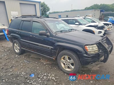 Czwarte zdjęcie samochodu z boku: 2003 JEEP GRAND CHEROKEE OVERLAND VIN:1J8GW68J53C555955 - miniatura