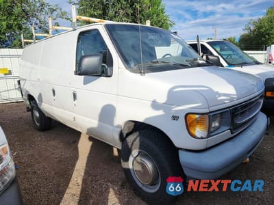 Czwarte zdjęcie samochodu z boku: 1999 FORD ECONOLINE E350 SUPER DUTY VAN VIN:1FTSE34L4XHA33918 - miniatura