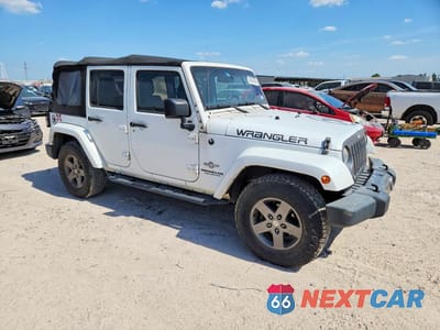 Czwarte zdjęcie samochodu z boku: 2015 JEEP WRANGLER UNLIMITED SPORT VIN:1C4BJWDG4FL568503 - miniatura