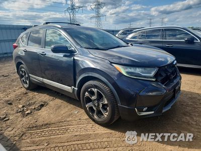 Czwarte zdjęcie samochodu z boku: 2017 HONDA CR-V TOURING VIN:2HKRW1H91HH503369 - miniatura