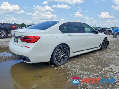 Trzecie zdjęcie samochodu z tyłu: 2018 BMW 750 XI VIN:WBA7F2C5XJG424324 - miniatura