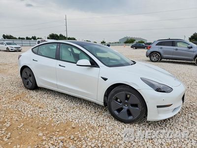 Czwarte zdjęcie samochodu z boku: 2022 TESLA MODEL 3 VIN:5YJ3E1EB4NF231233 - miniatura
