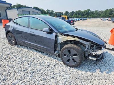Czwarte zdjęcie samochodu z boku: 2023 TESLA MODEL 3 VIN:5YJ3E1EA1PF655706 - miniatura