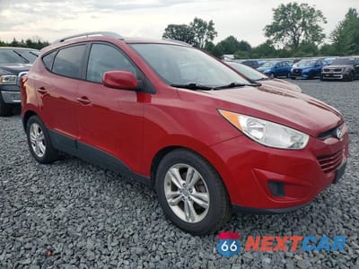 Czwarte zdjęcie samochodu z boku: 2010 HYUNDAI TUCSON GLS VIN:KM8JUCAC6AU021685 - miniatura