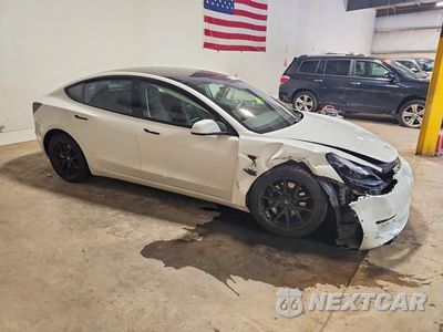 Czwarte zdjęcie samochodu z boku: 2021 TESLA MODEL 3 VIN:5YJ3E1EAXMF982150 - miniatura