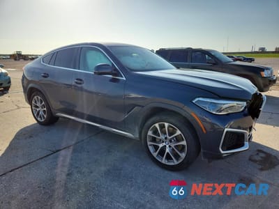 Czwarte zdjęcie samochodu z boku: 2020 BMW X6 XDRIVE40I VIN:5UXCY6C05L9C18134 - miniatura