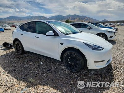 Czwarte zdjęcie samochodu z boku: 2023 TESLA MODEL Y VIN:7SAYGDEE1PF605427 - miniatura