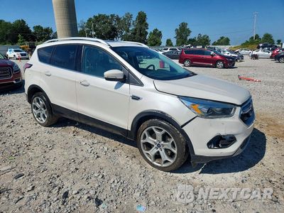 Czwarte zdjęcie samochodu z boku: 2017 FORD ESCAPE TITANIUM VIN:1FMCU9J99HUA33386 - miniatura