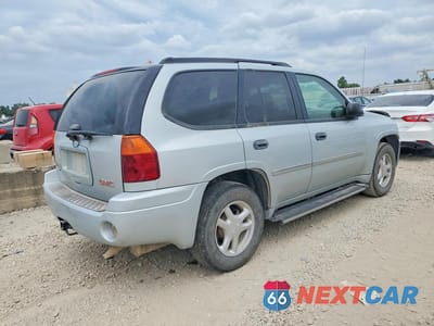 Trzecie zdjęcie samochodu z tyłu: 2007 GMC ENVOY VIN:1GKDS13S272214618 - miniatura
