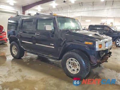 Czwarte zdjęcie samochodu z boku: 2003 HUMMER H2 VIN:5GRGN23U83H113399 - miniatura