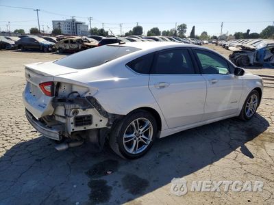 Trzecie zdjęcie samochodu z tyłu: 2016 FORD FUSION SE HYBRID VIN:3FA6P0LU3GR354776 - miniatura