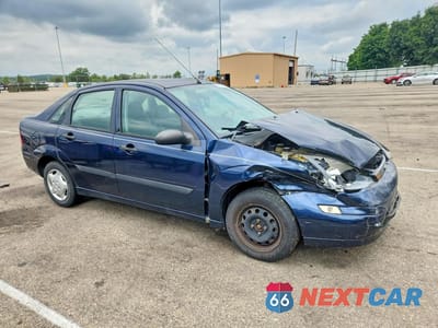 Czwarte zdjęcie samochodu z boku: 2003 FORD FOCUS LX VIN:1FAFP33PX3W267816 - miniatura