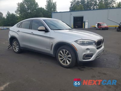 Czwarte zdjęcie samochodu z boku: 2019 BMW X6 XDRIVE35I VIN:5UXKU2C51K0Z63491 - miniatura