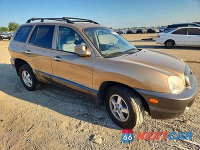 Czwarte zdjęcie samochodu z boku: 2002 HYUNDAI SANTA FE GLS VIN:KM8SC73D32U314028 - miniatura