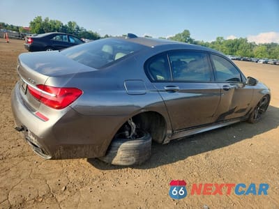 Trzecie zdjęcie samochodu z tyłu: 2017 BMW 740 I VIN:WBA7E2C58HG740107 - miniatura