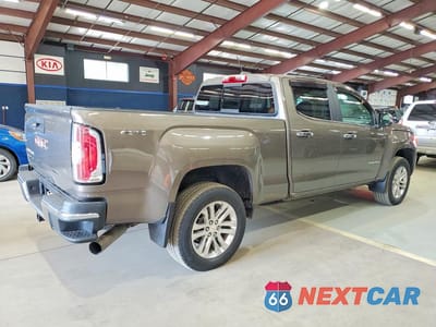 Trzecie zdjęcie samochodu z tyłu: 2016 GMC CANYON SLT VIN:1GTP6DE10G1325113 - miniatura
