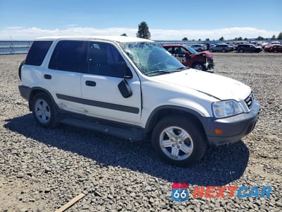 Czwarte zdjęcie samochodu z boku: 1999 HONDA CR-V LX VIN:JHLRD1840XC030524 - miniatura