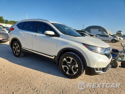 Czwarte zdjęcie samochodu z boku: 2017 HONDA CR-V TOURING VIN:2HKRW2H95HH654799 - miniatura