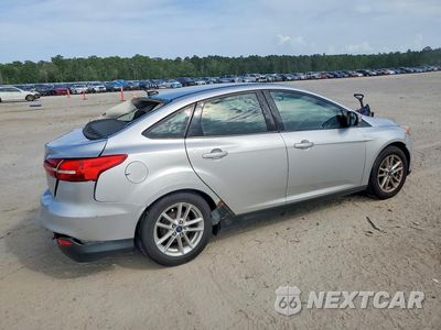 Trzecie zdjęcie samochodu z tyłu: 2017 FORD FOCUS SE VIN:1FADP3F29HL250571 - miniatura