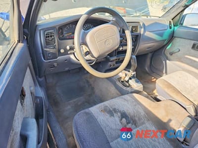 Zdjęcie 8 z 13 samochodu: 1999 TOYOTA TACOMA BASE VIN:4TAWM72N7XZ524859 - miniatura