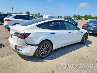 Trzecie zdjęcie samochodu z tyłu: 2021 TESLA MODEL 3 VIN:5YJ3E1EA0MF090103 - miniatura